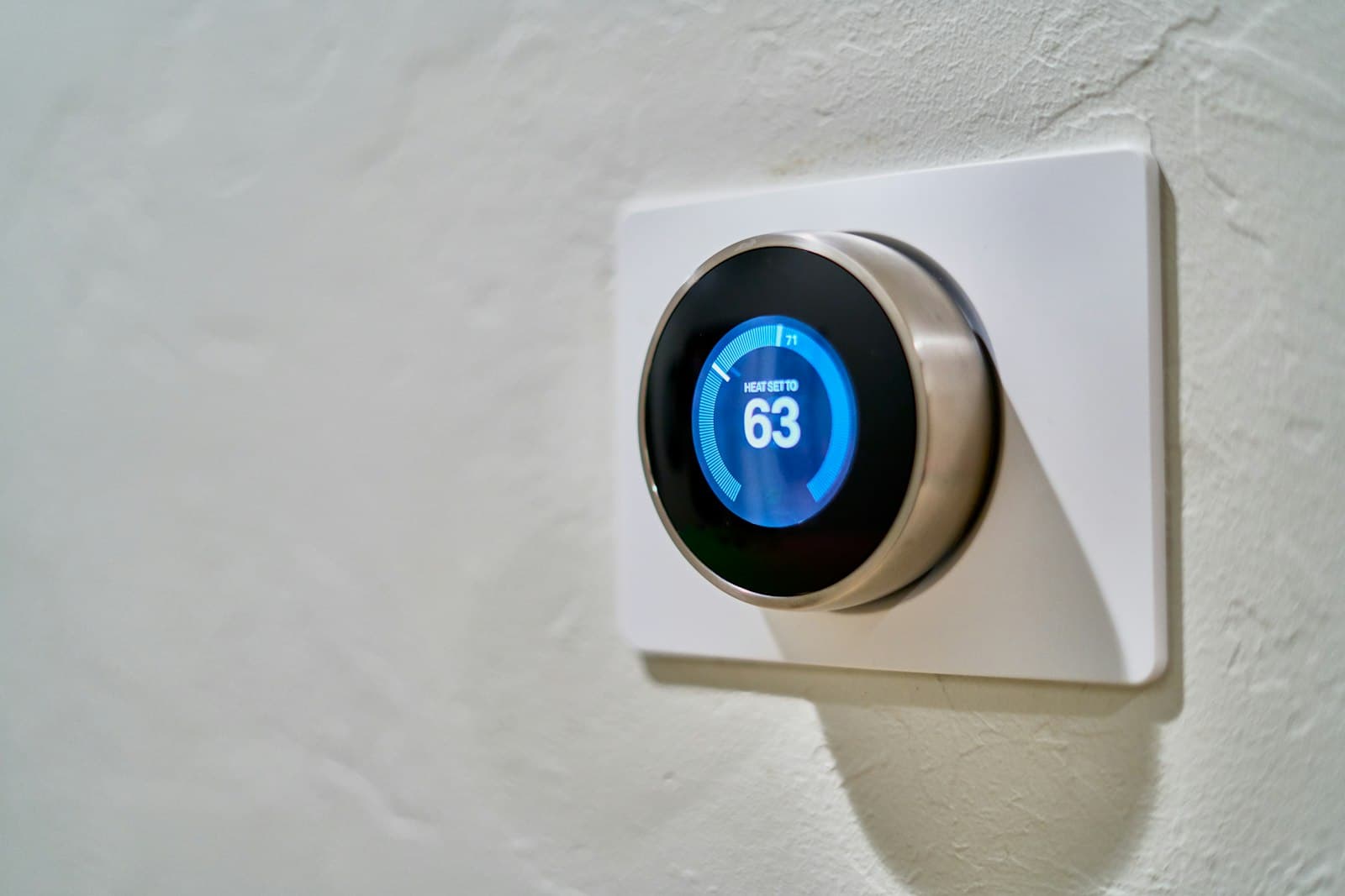 Smart thermostat on a home wall